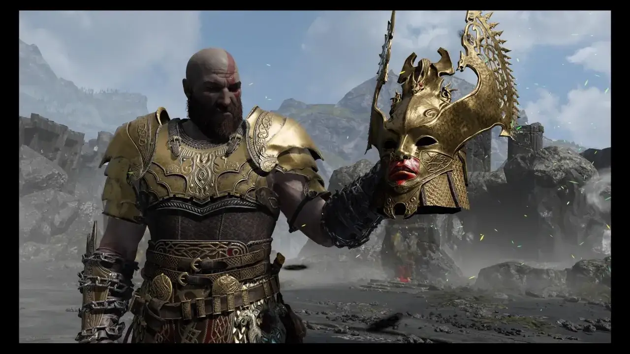 Kratos, el dios de la guerra, sostiene la máscara de una valquiria.